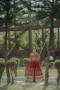 Bride Posing Beneath Outdoor Wedding Architecture