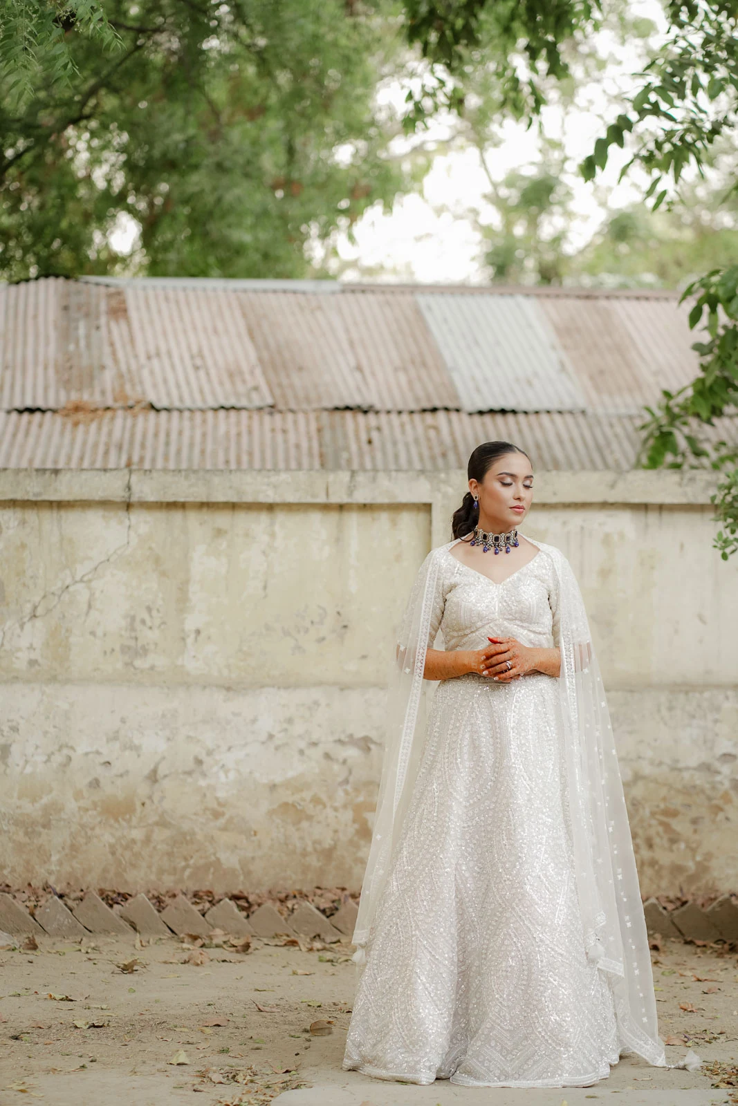 Bride Standing Against Elegant Heritage Architecture