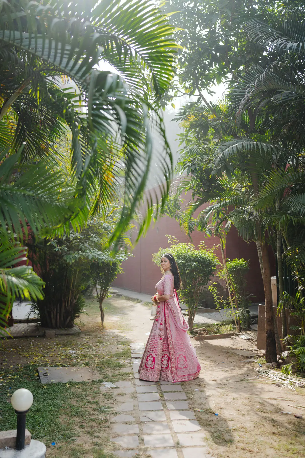 Bride Walking Through Tropical Garden
