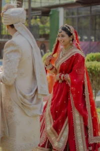 Bride and Groom Candid Moment in Traditional Wedding Attire
