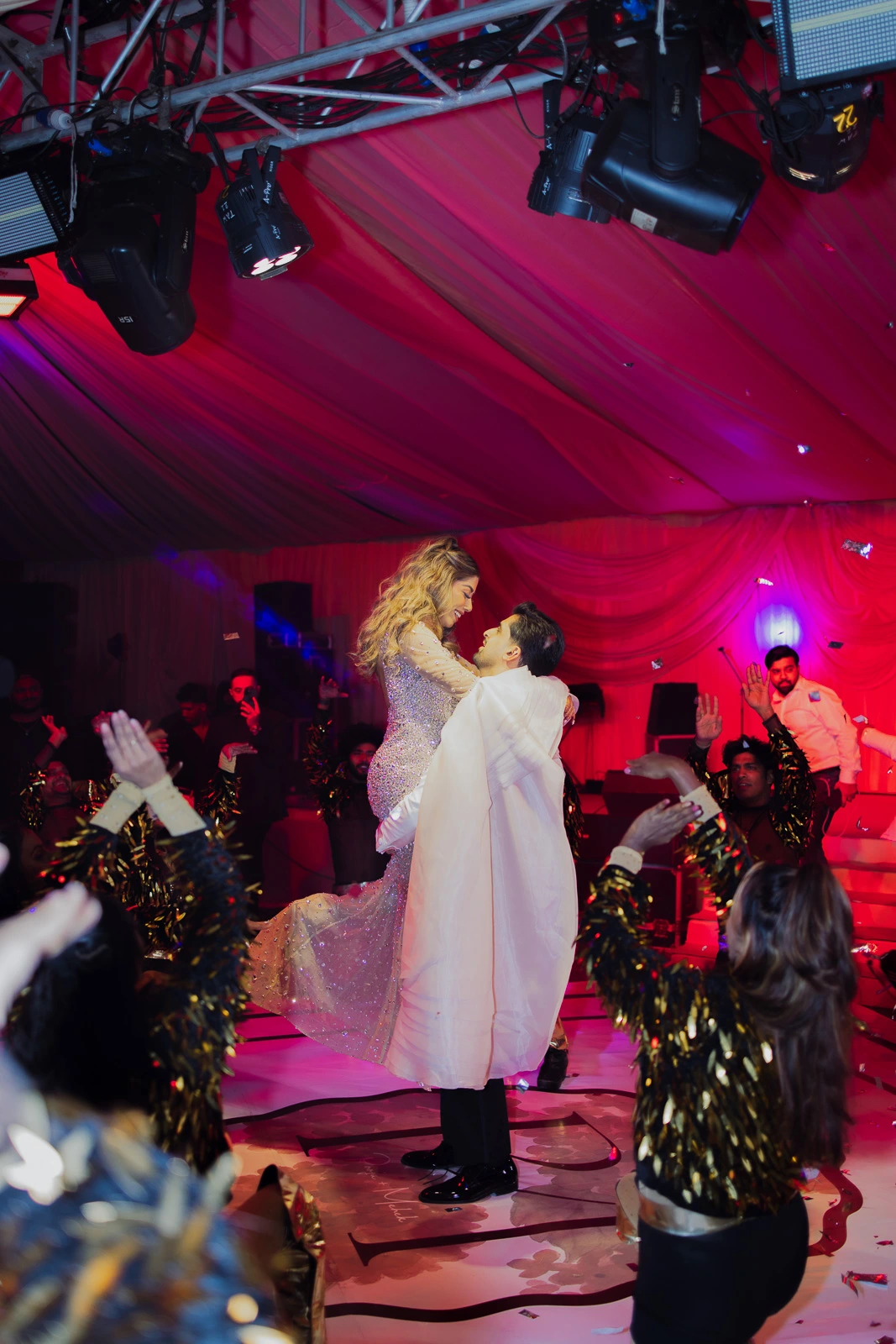Bride and Groom During a Colorful Evening Event