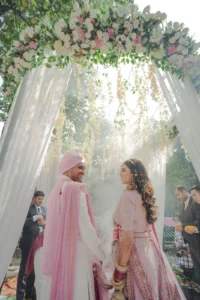 Bride and Groom Framed by Floral Wedding Decor