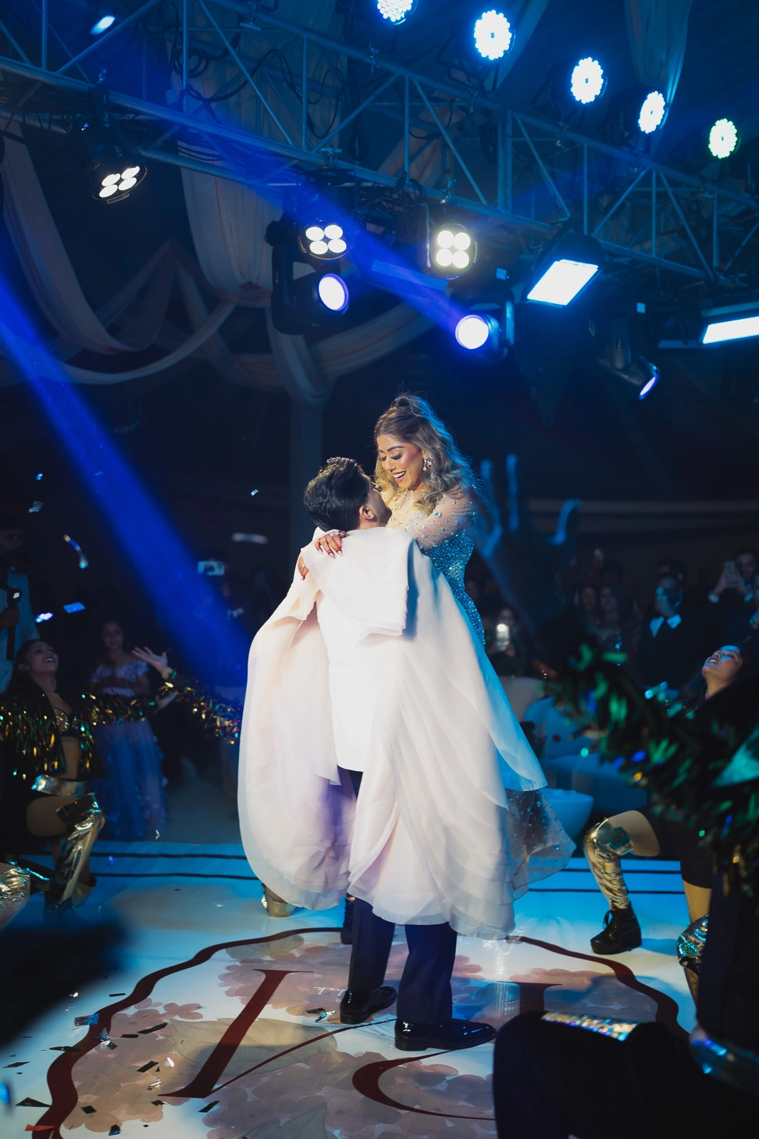 Bride and Groom Under Blue Event Lighting