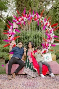 Bride and Groom Under Colorful Floral Wedding Decor