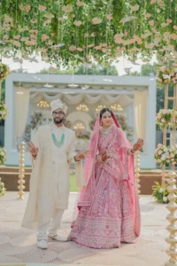 Bride and Groom Under Floral Canopy