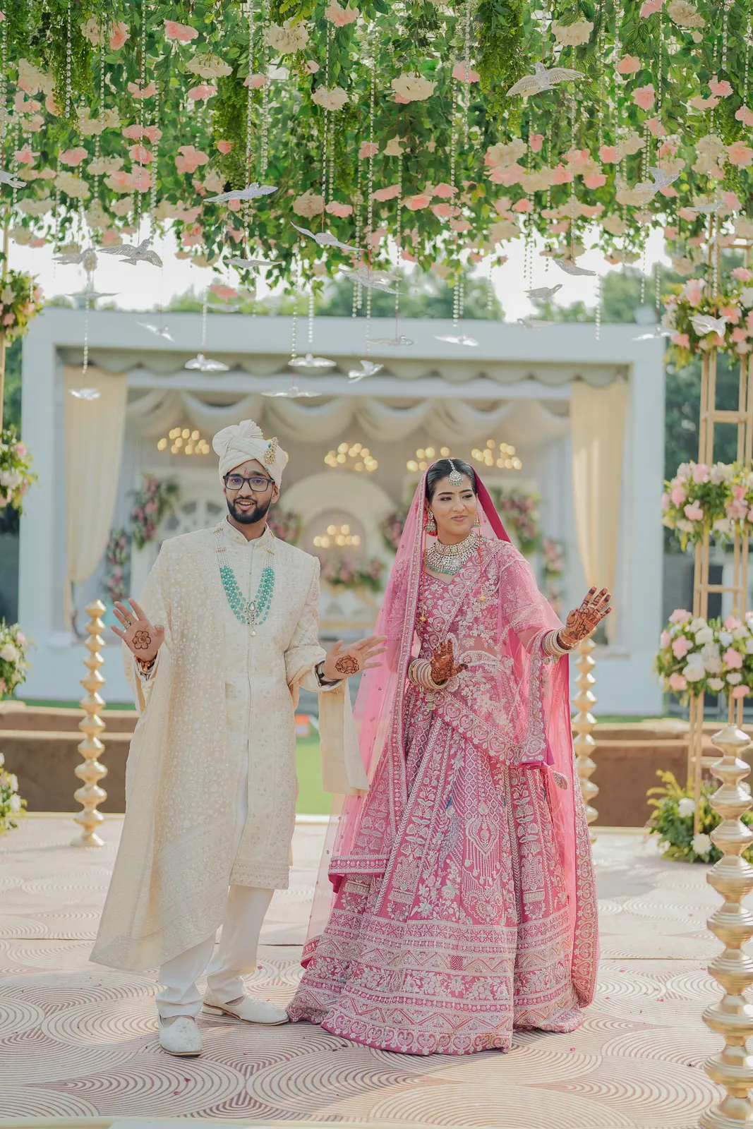Bride and Groom Under Floral Canopy