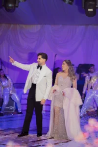 Bride and Groom Under Purple Event Lighting