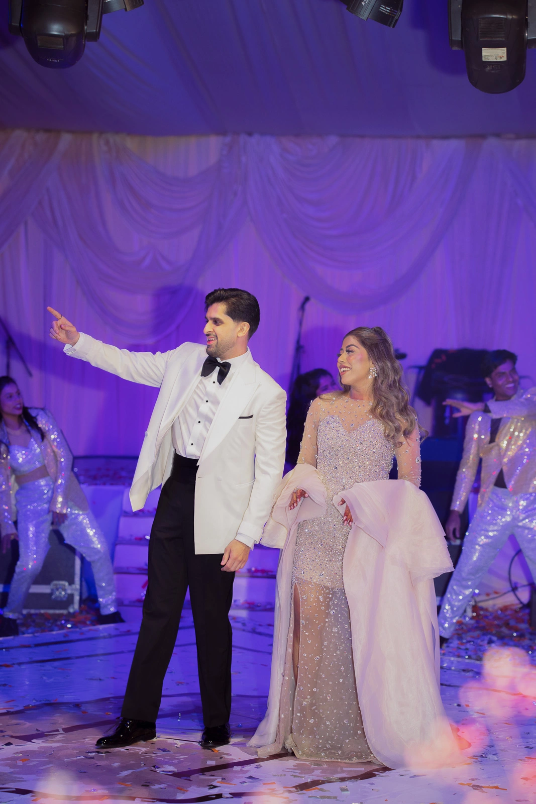 Bride and Groom Under Purple Event Lighting