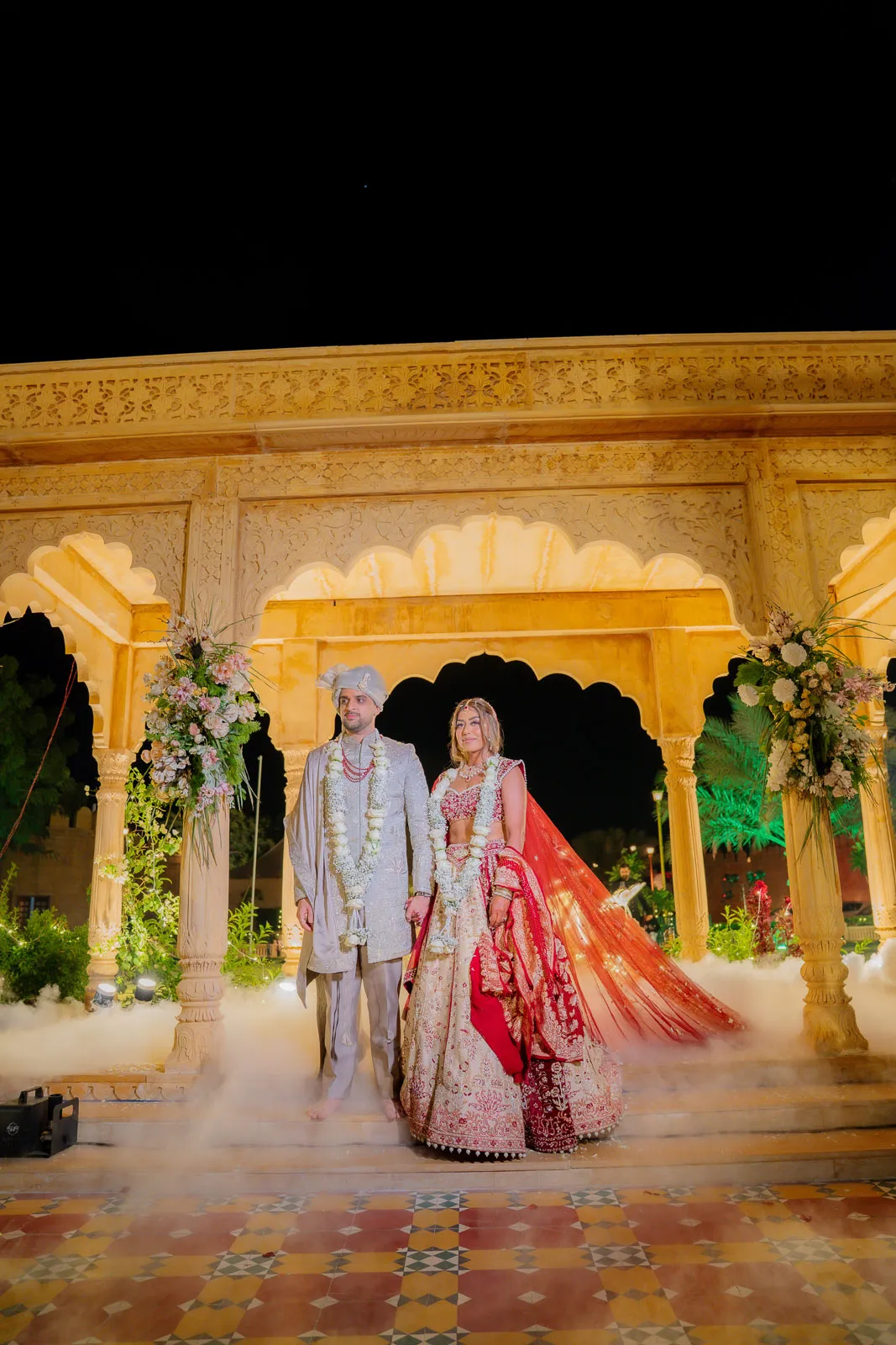 Bride and Groom Under a Royal Archway