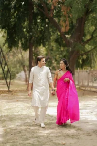 Bride and Groom Walking Through Garden Venue