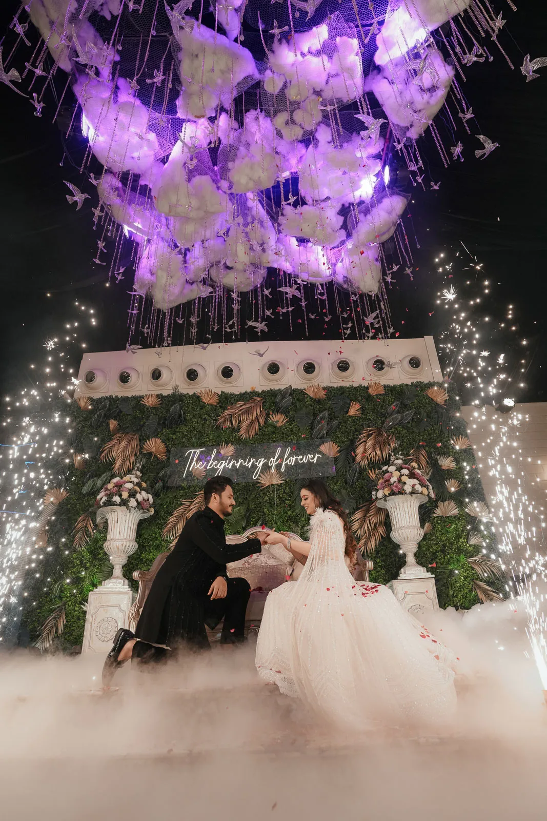 Bride and Groom Walking Through Reception Decor