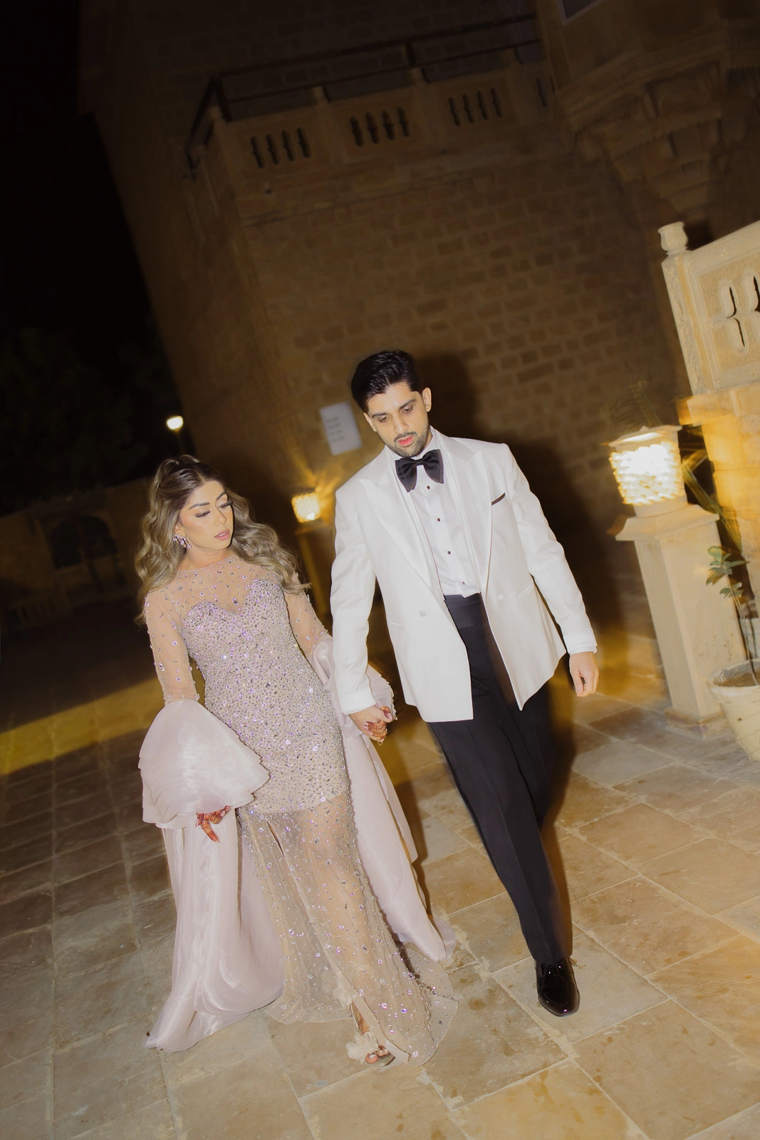 Bride and Groom Walking Through a Heritage Interior