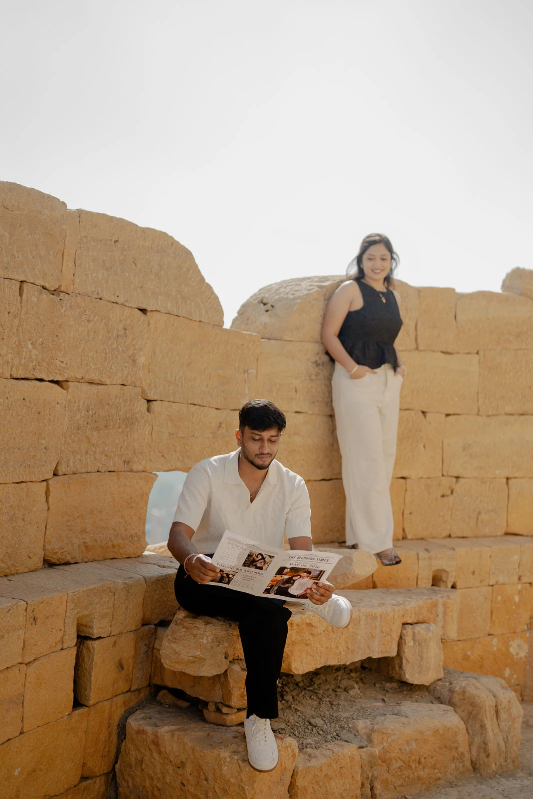 Candid Couple Moment Against Golden Sandstone