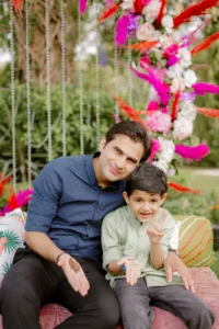 Candid Couple Portrait Among Colorful Flowers