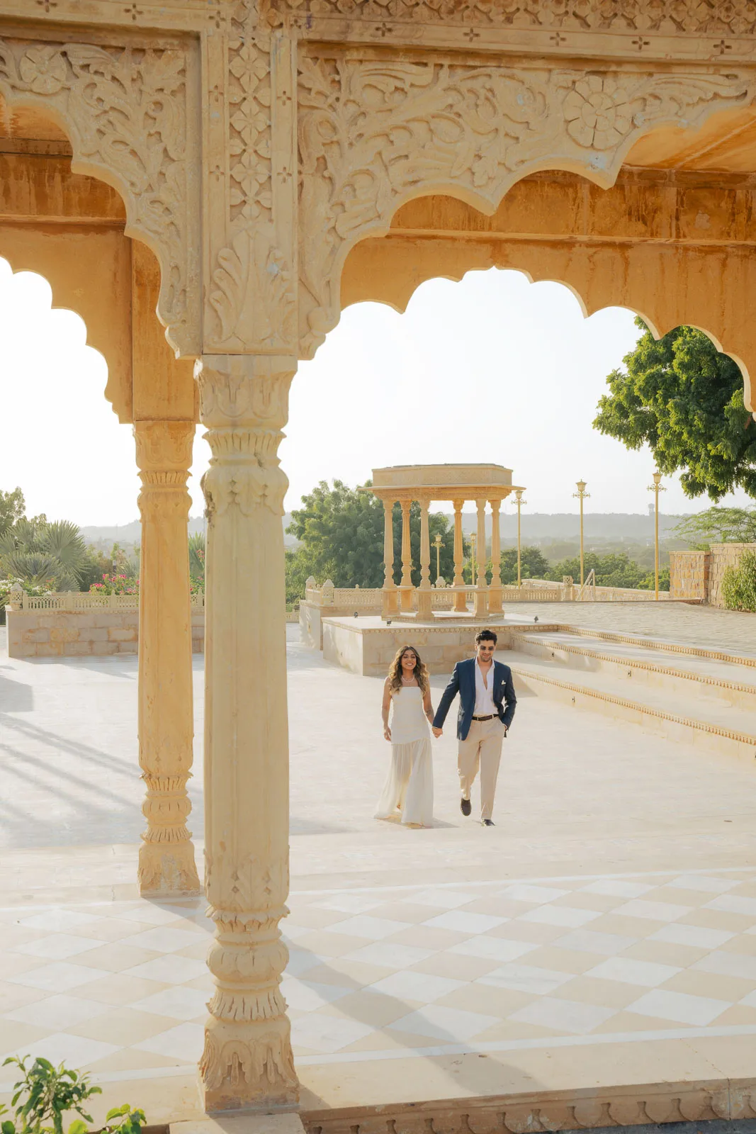Classic Couple Walk Through a Jaisalmer Courtyard