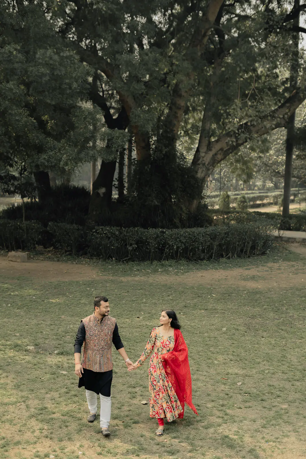 Couple Walking Through a Serene Delhi Garden