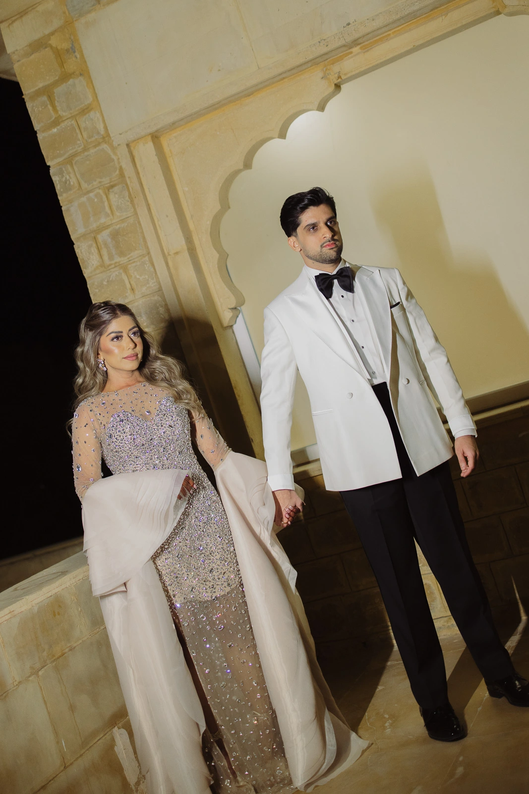 Couple Walking Together Through an Interior Space