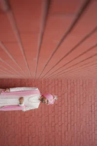 Creative Groom Portrait with Geometric Terracotta Background