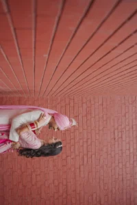 Creative Wedding Portrait with Pink Architectural Background