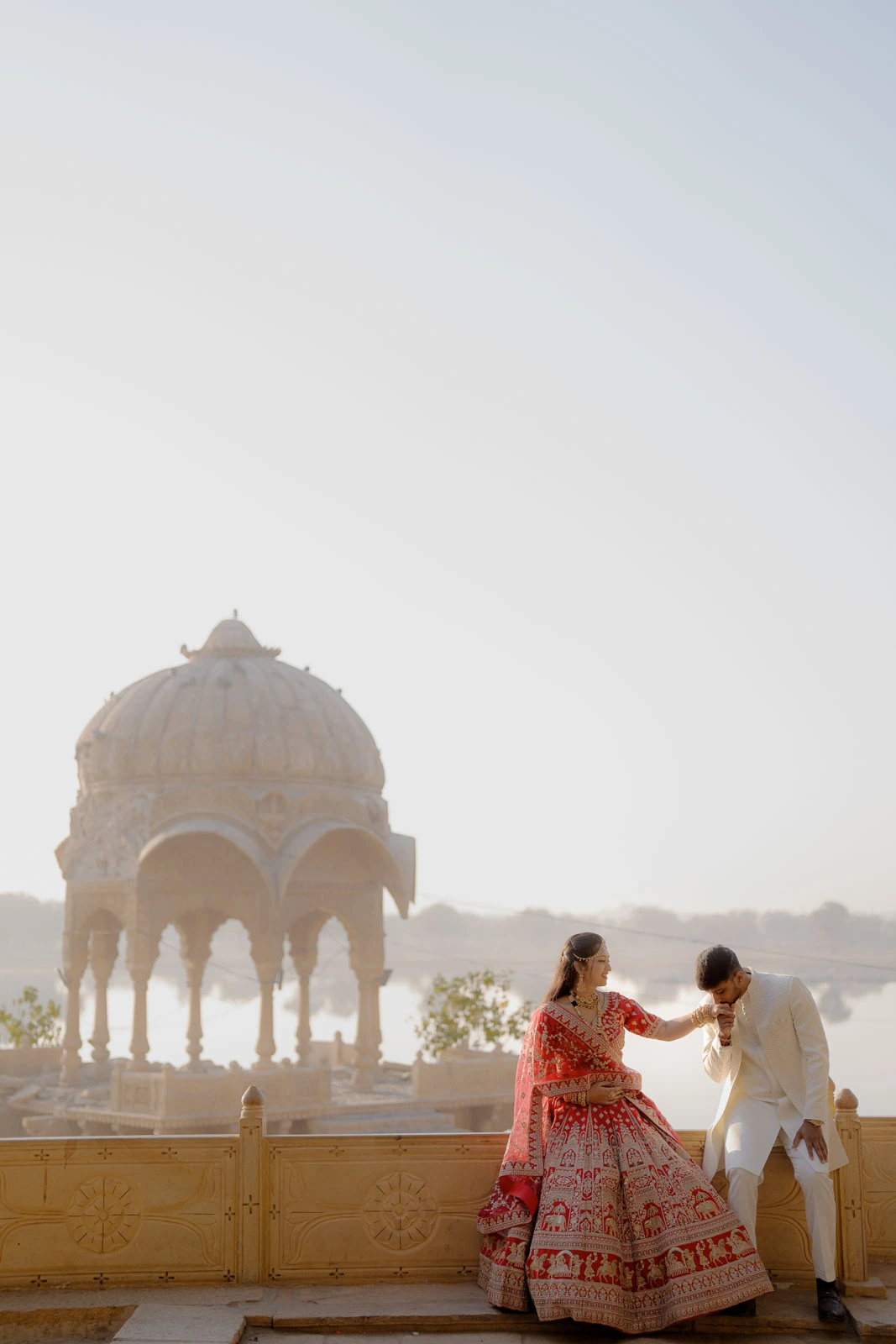 Dreamy Couple Portrait Framed by Golden Architecture