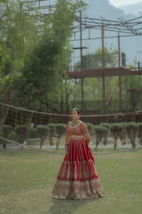 Elegant Bride in Red Lehenga at Outdoor Wedding Venue