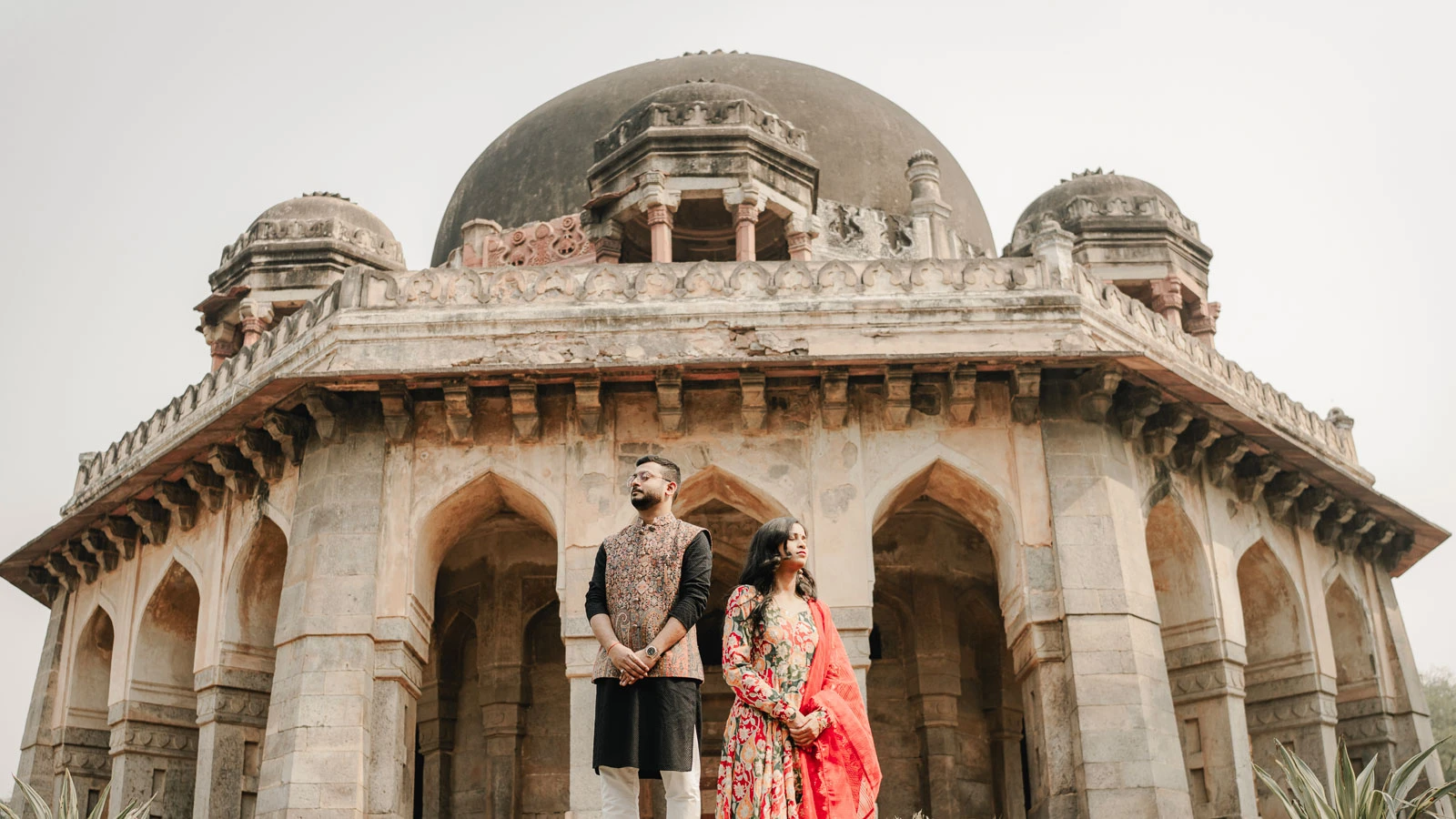Elegant Couple Beneath a Delhi Heritage Facade