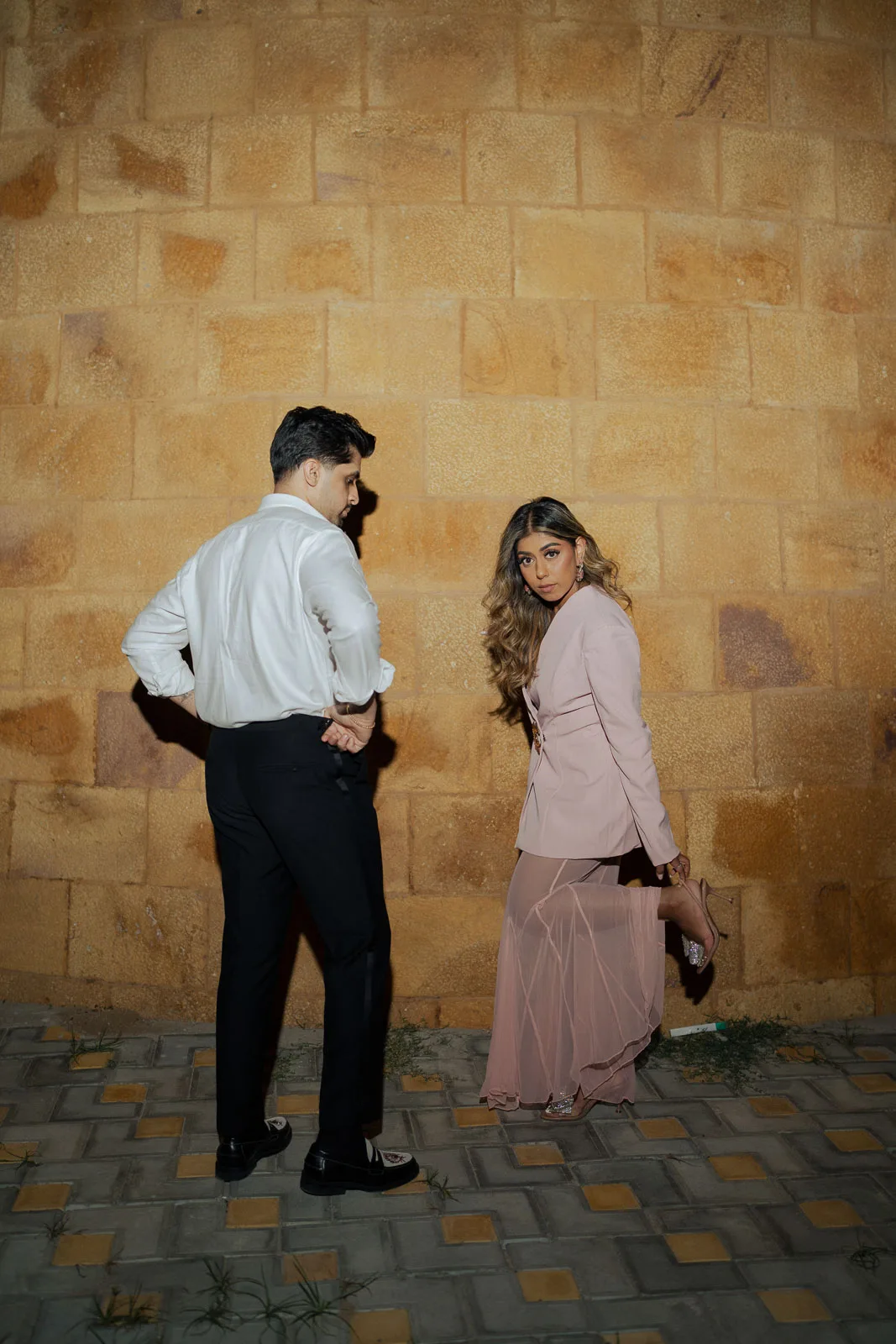 Elegant Couple Portrait Amid Golden Sandstone