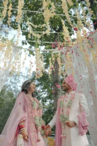 Elegant Couple Portrait Under Outdoor Wedding Decor
