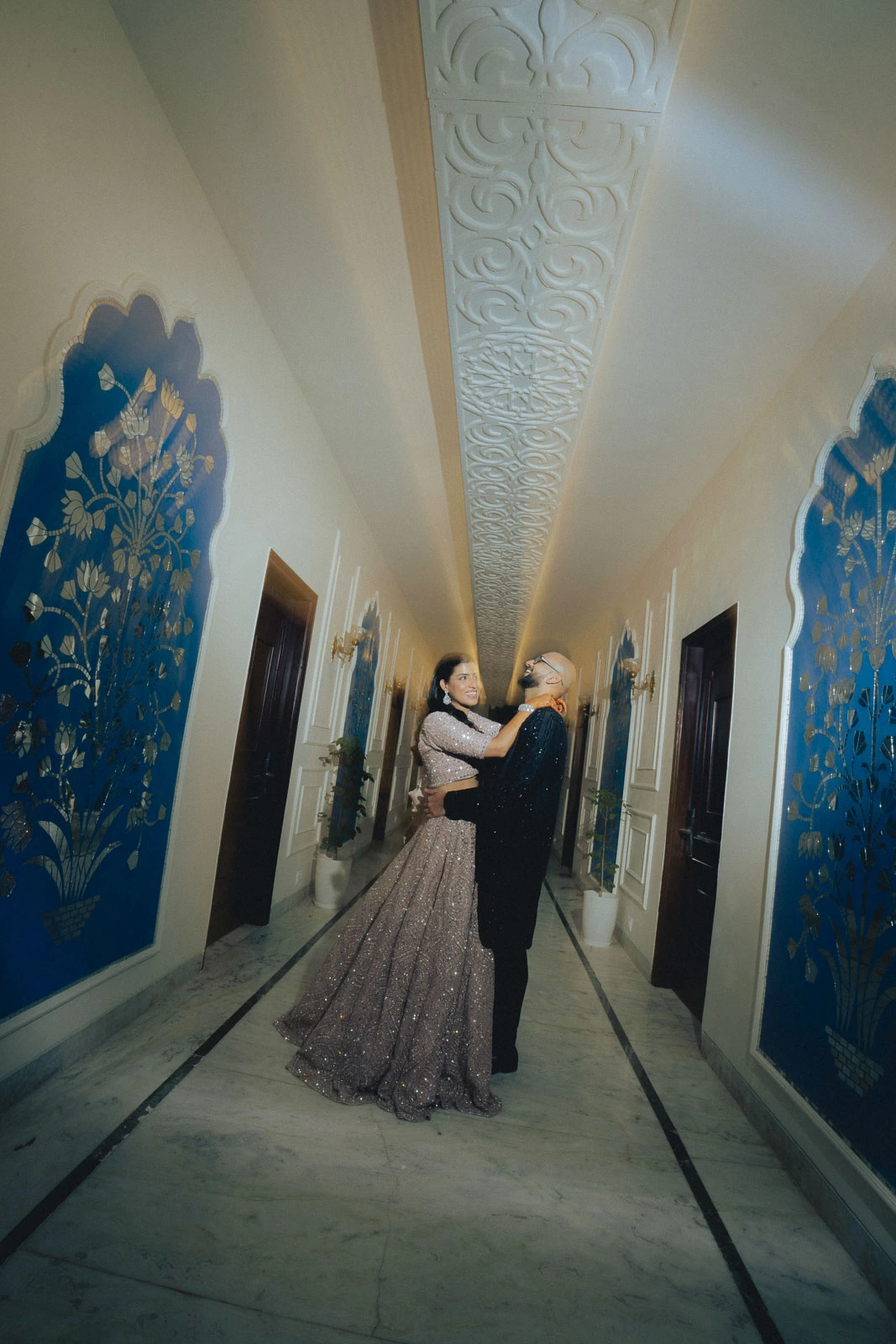 Elegant Couple Walking Through the Venue