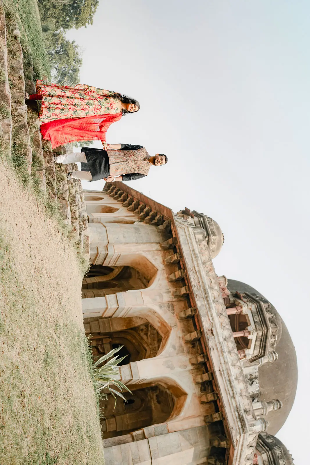Graceful Couple Portrait Beneath Delhi’s Historic Arches