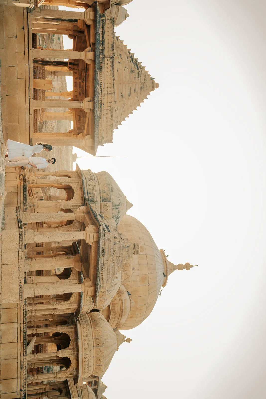 Graceful Couple Pose Against Jaisalmer Walls