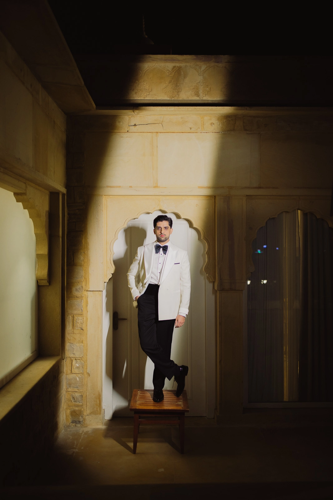 Groom Portrait in a Warmly Lit Room
