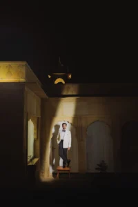Groom Standing in a Golden Room