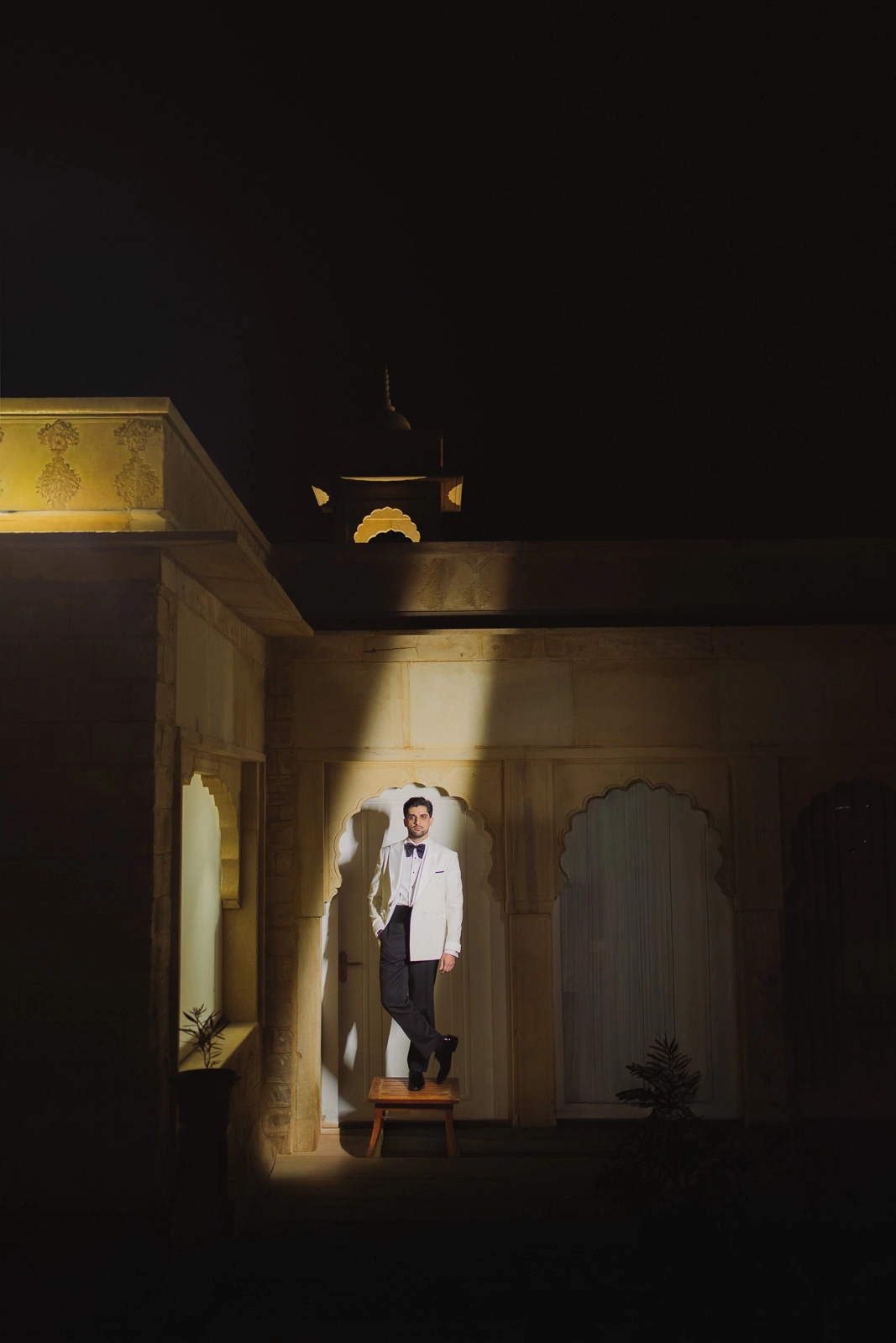 Groom Standing in a Golden Room