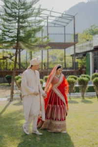 Newlywed Couple Walking Through Outdoor Wedding Venue
