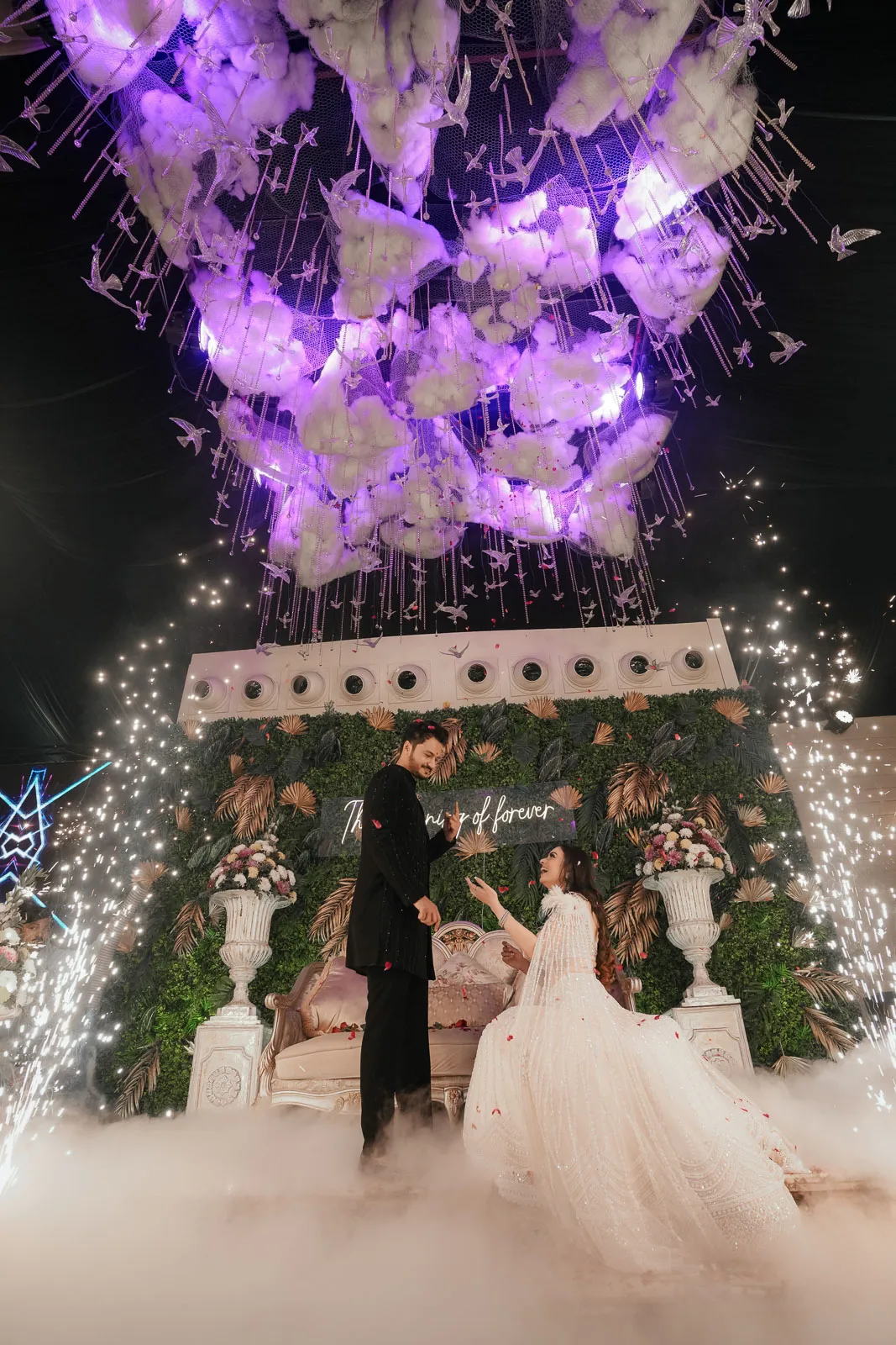 Romantic Couple Portrait Beneath Purple Floral Lighting