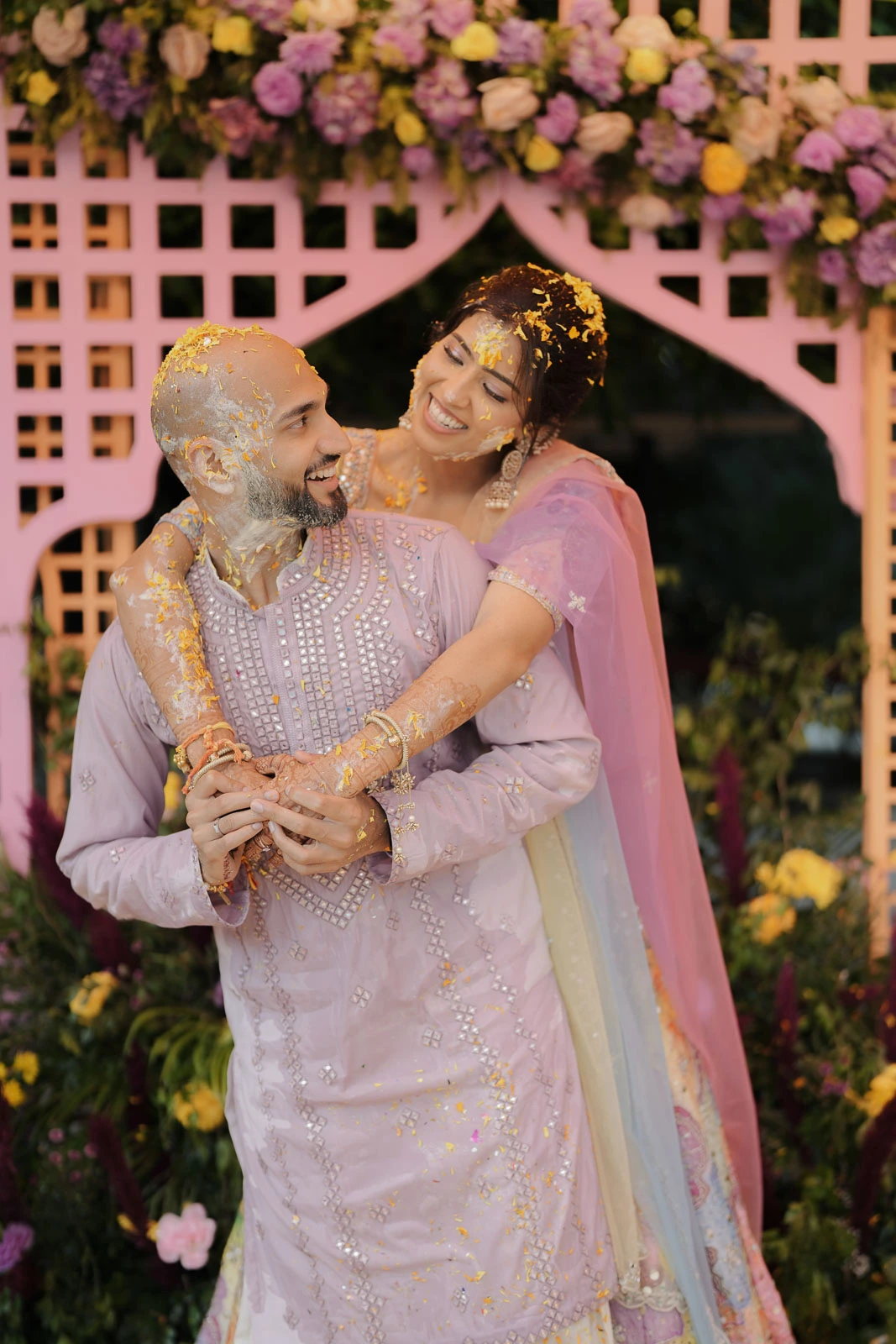 Romantic Couple Portrait with Floral Backdrop
