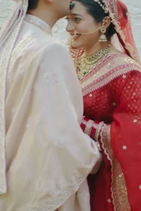 Romantic Newlywed Couple Portrait in Red Wedding Attire