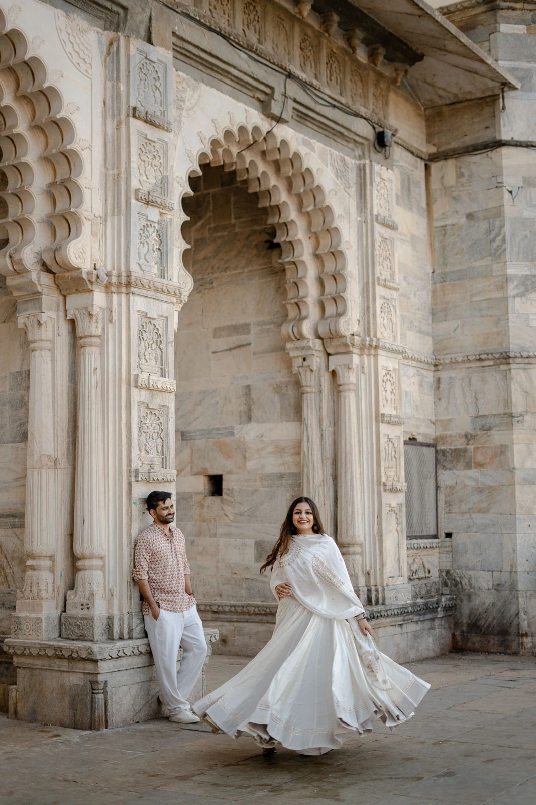 Royal Couple Portrait Beneath an Ornate Udaipur Arch