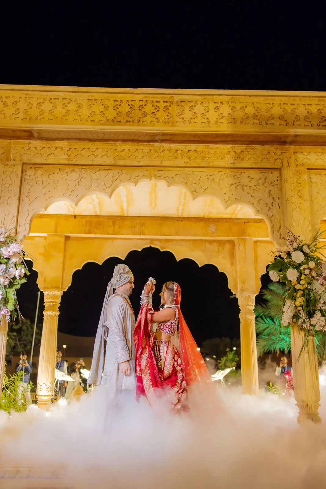 The Couple Under a Canopy of Warm Lights