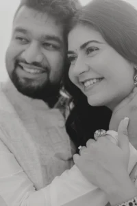 Black and white close-up portrait of smiling couple