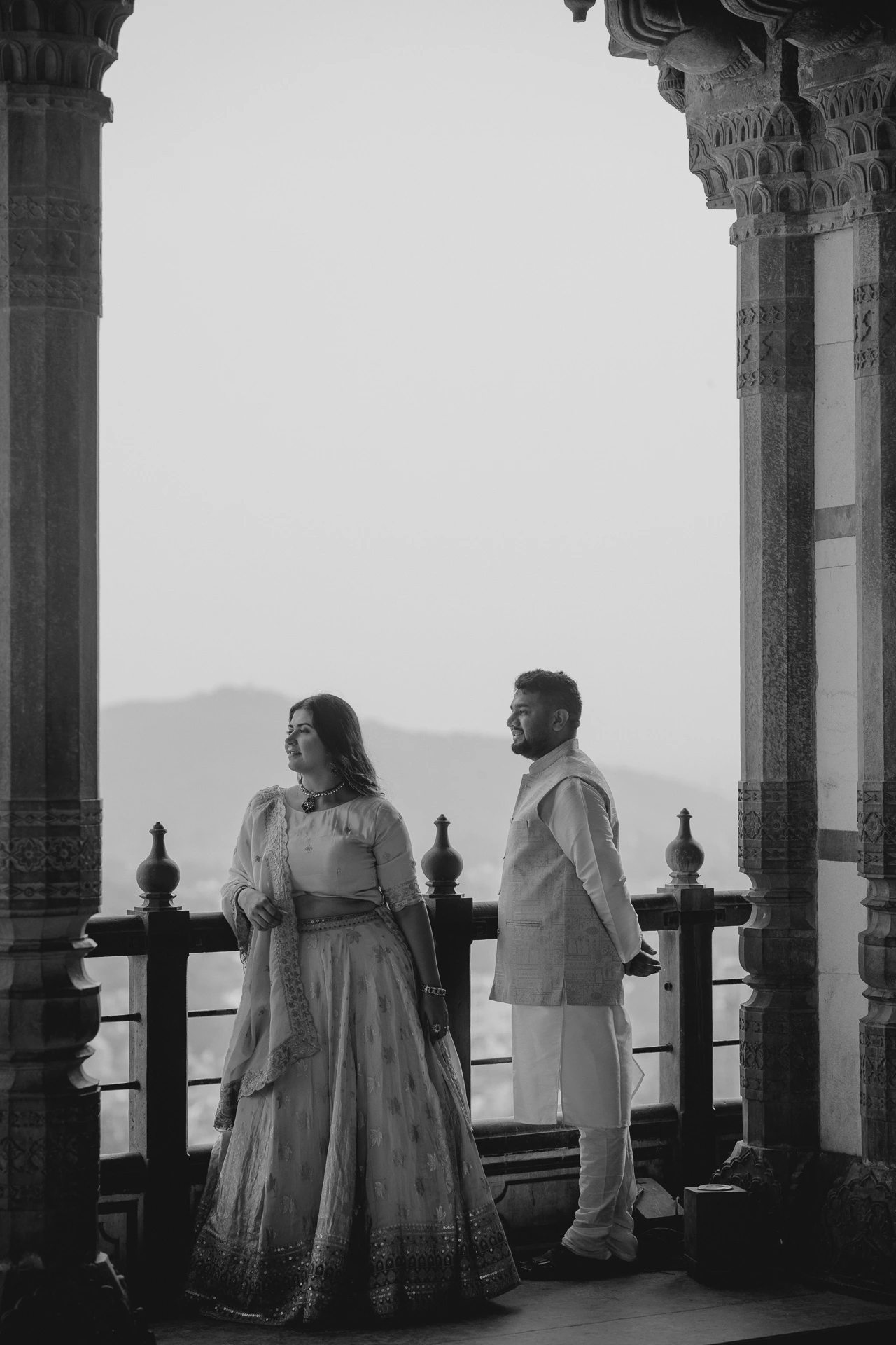 Black and white photo of couple on a fort terrace