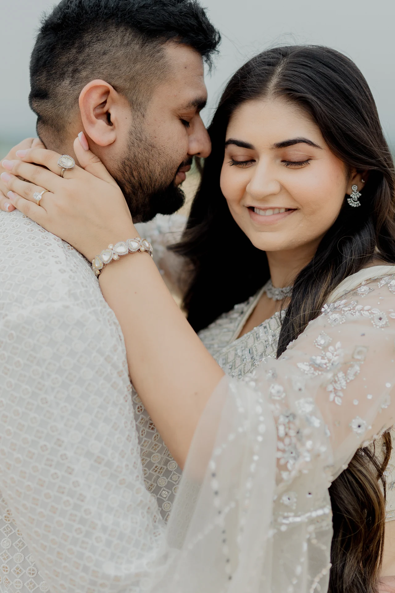 Close-up of couple with woman touching man_s face