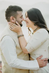 Close-up of couple_s faces nearly touching, white outfits