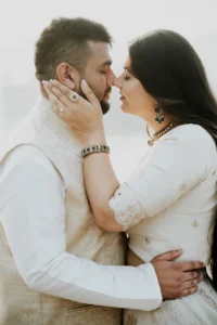 Close-up of couple_s faces touching, foggy lake backdrop