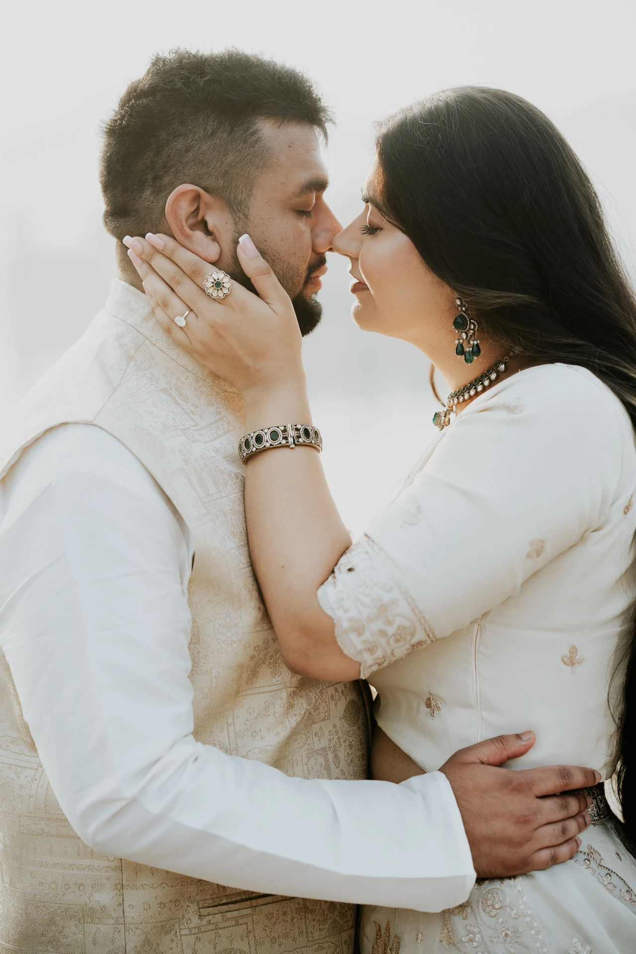 Close-up of couple_s faces touching, foggy lake backdrop