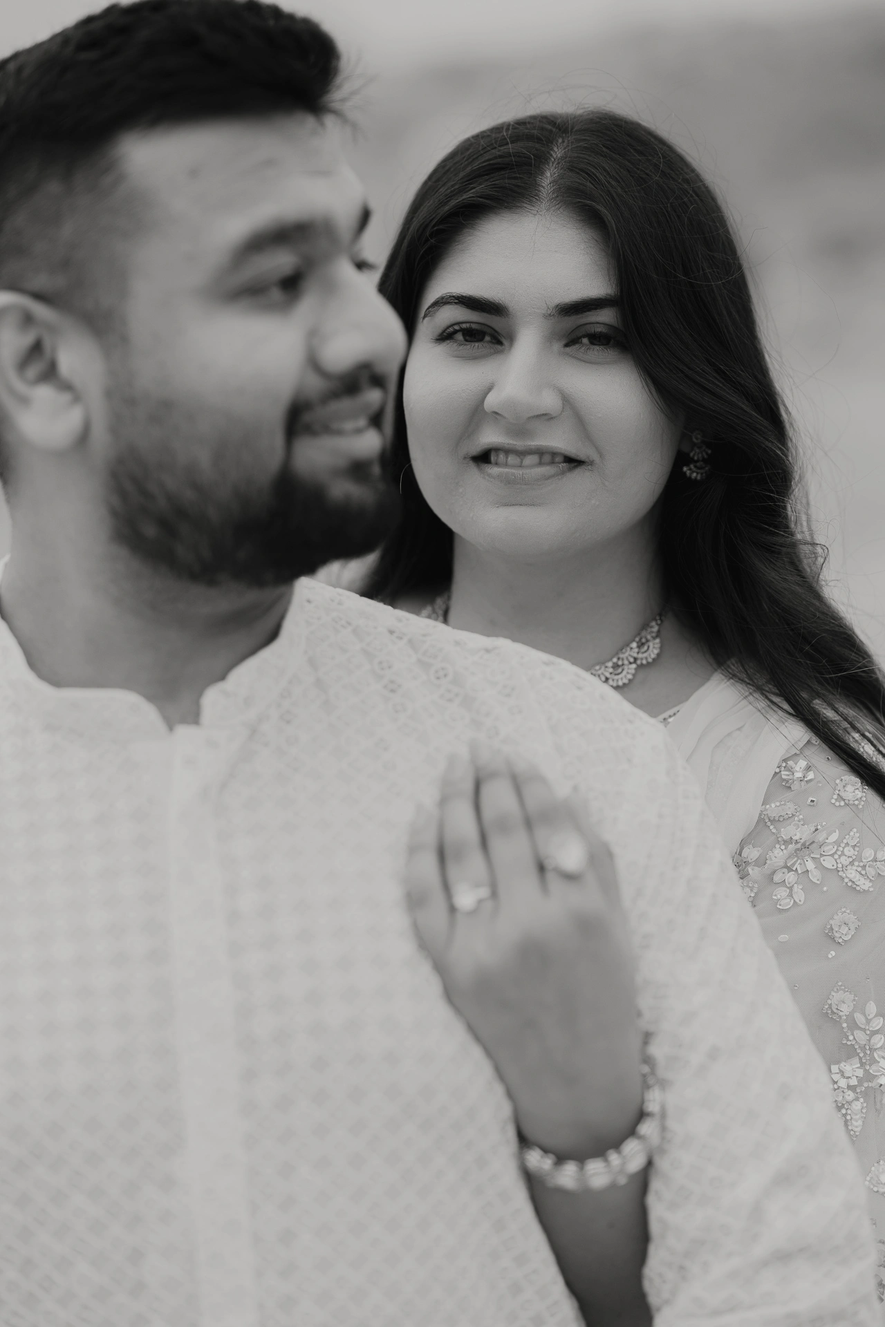 Close-up portrait of couple in white outfits, Jaipur pre-wedding shoot