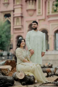 Couple seated on a stone ledge at a Jaipur haveli