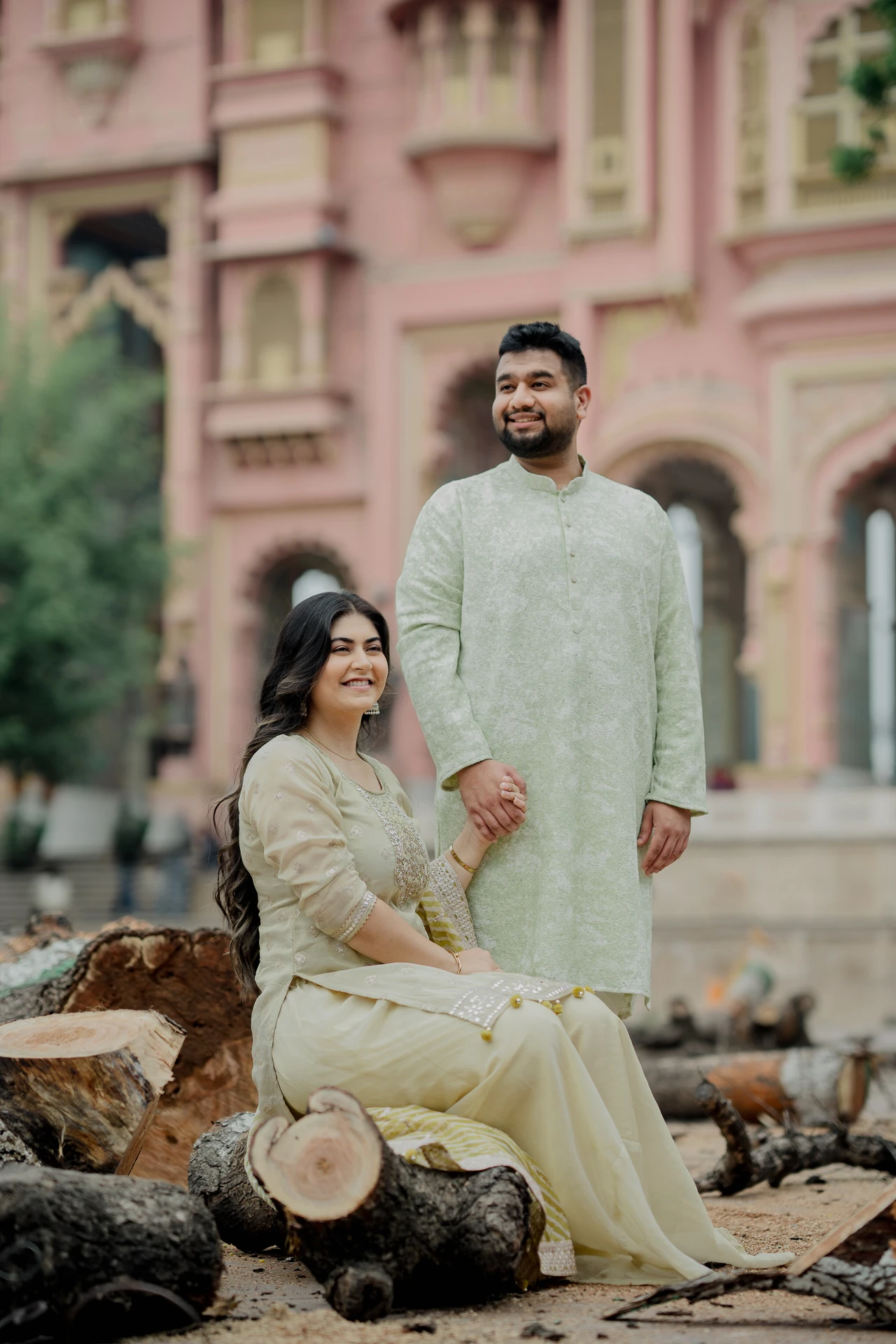 Couple seated on a stone ledge at a Jaipur haveli