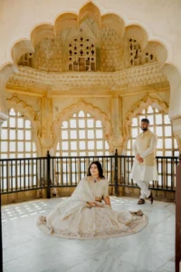 Couple seated together in a latticed fort window